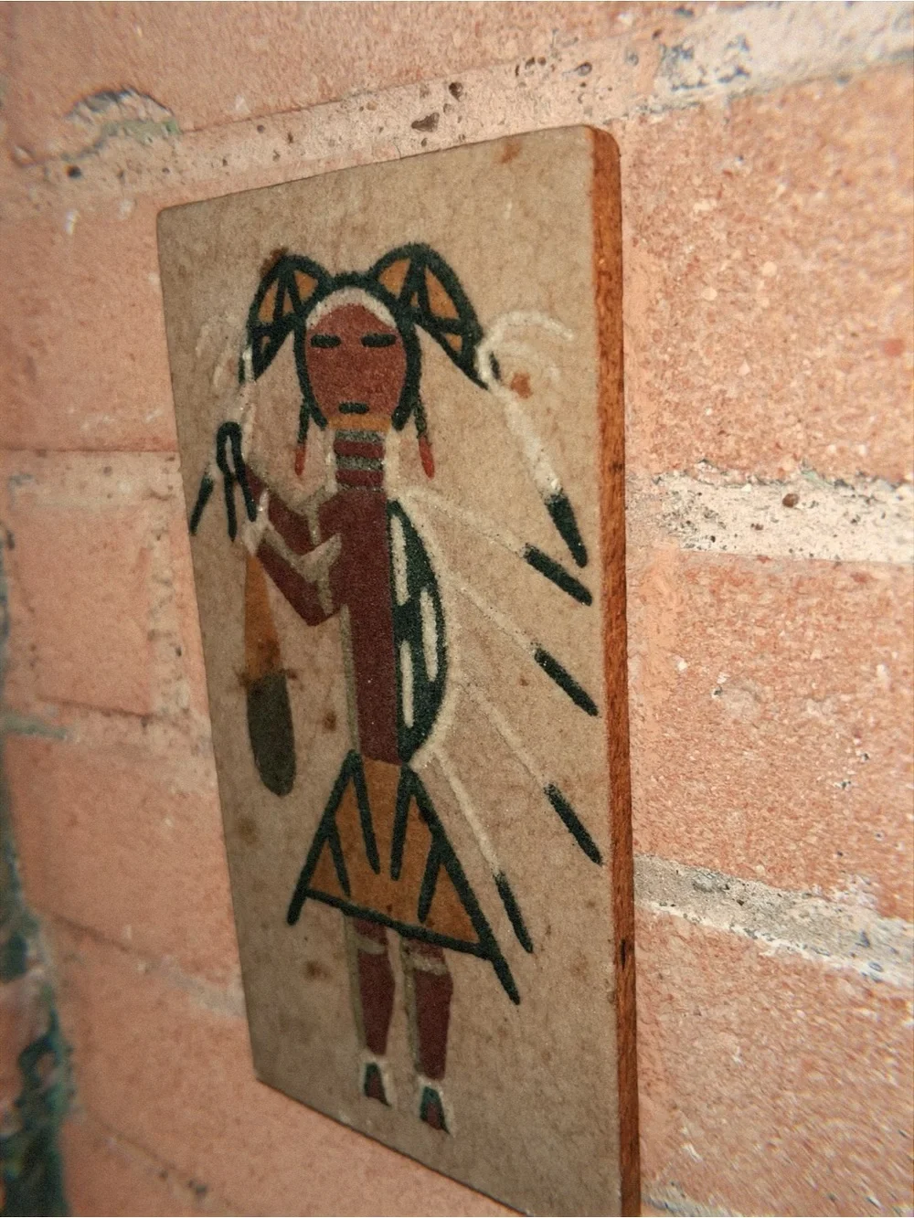 Navajo Native American sand painting of a women figure in geometric shapes